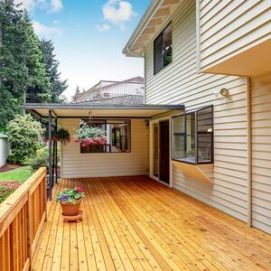 wooden walkout deck with flowers 